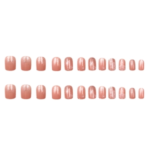Winter snowflake press-on nails with silver glitter and starburst designs on nude pink base