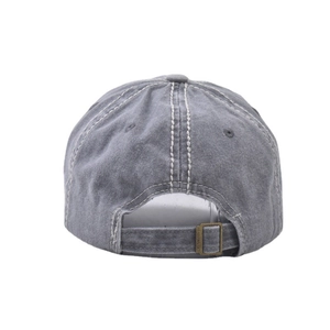 Detail of washed grey cotton baseball cap showing contrast stitching and metal adjustment buckle