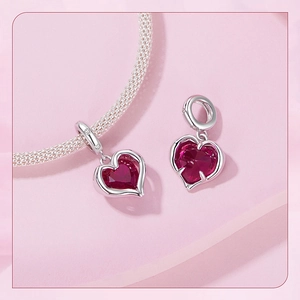 Detailed view of red heart crystal charm set in S925 silver on a snake chain