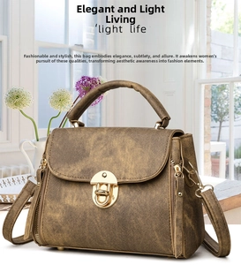 Detail of vintage brown PU leather handbag featuring metal clasp and adjustable strap
