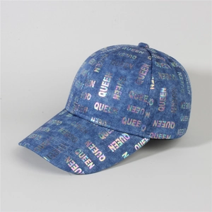 Detailed view of blue denim baseball cap featuring colorful QUEEN letter prints