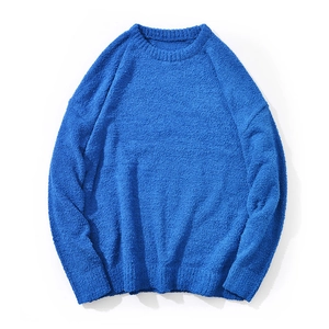 Flat lay of blue chenille knit sweater featuring ribbed crewneck and soft fuzzy texture