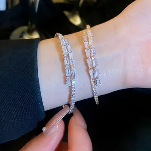 Sparkling zircon open bracelet in silver and rose gold tones with step-cut crystals