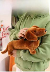 Close-up of soft plush dachshund toy fabric held by a model for comfort display
