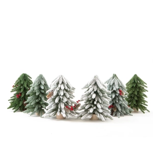 Mini artificial Christmas tree set with snow, berries, and wooden bases for table decor