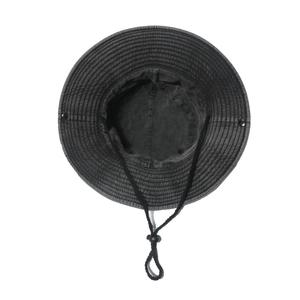Detail of black washed cotton bucket hat showing adjustable chin strap and metal eyelets