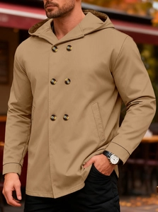 Close-up of khaki hooded trench coat with double-breasted buttons and fine cotton texture