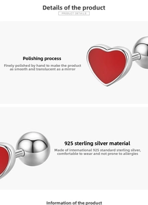 Macro view of 925 sterling silver heart earrings with red enamel and screw-back detail