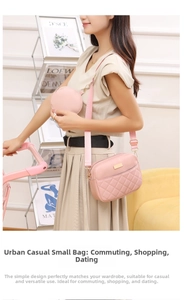 Close-up of pink quilted camera bag with adjustable strap and small round coin purse