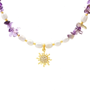 Freshwater pearl necklace with irregular purple gemstones and golden sun pendant