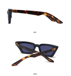 Details von Retro-Cateye-Sonnenbrille mit Bügeln im Leopardenmuster und Metallakzenten