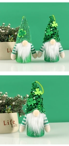 Close-up of St. Patrick's Day gnome dolls with green sequin hats and clover decorations