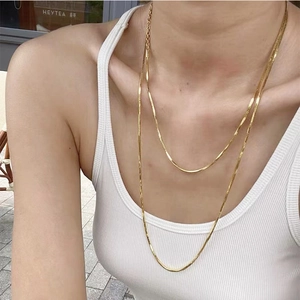 Gold titanium steel flat snake chain layered necklace set with glossy metallic finish