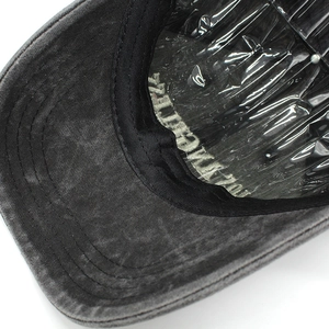 Macro shot of washed gray baseball cap showing inner sweatband and reinforced stitching