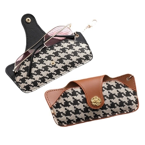 Portable houndstooth fabric and leather glasses pouch in black and brown colors