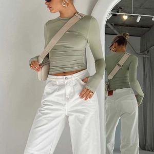 Detailed mirror view showing sage green slim fit long sleeve top front and back fit