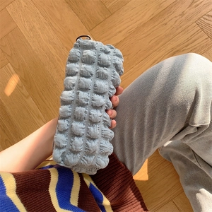 Detail shot of light blue bubble textured pencil case with soft fiber fabric material