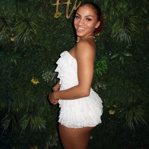 Detailed view of layered white lace ruffles on a strapless summer romper for women