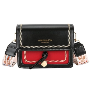 Chic black and red crossbody bag with embroidery and ethnic style shoulder strap
