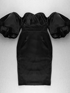 Detail of elegant black satin off-shoulder dress featuring puffy lantern sleeves texture