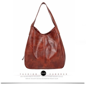 Back view of brown retro hobo bag showing textured faux leather and shoulder strap