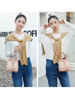 Straw bucket bag with pink leather trim shown in hand-carry and crossbody styles