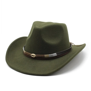 Detail of dark green wool fedora hat featuring woven band and gold shell ornament