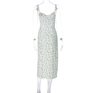 Back view of floral midi sundress with split hem on professional display mannequin