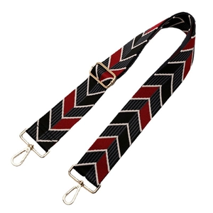 Adjustable woven canvas shoulder strap with red black white chevron pattern and gold hardware