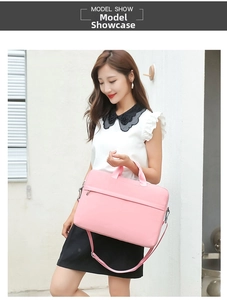 Pink waterproof laptop bag with adjustable shoulder strap and hidden zipper pocket detail