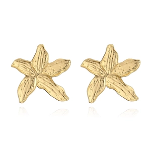 Detailed close-up of golden starfish stud earrings featuring textured brushed metal finish
