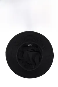 Detailed view of internal wash label and durable fabric lining on black bucket hat