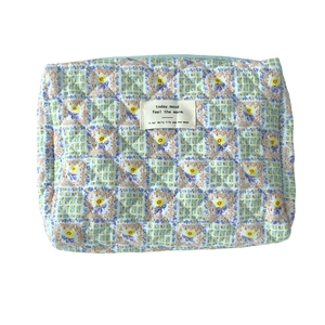 Floral quilted cotton storage makeup bag with colorful patchwork patterns on white background