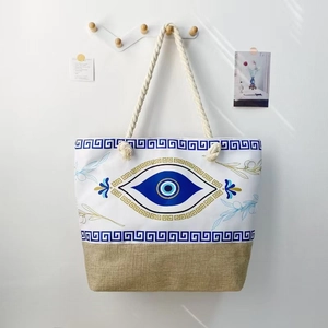 Canvas evil eye beach tote bag with jute patchwork and thick rope handles for women