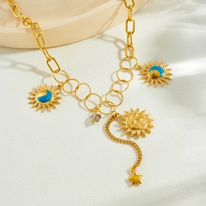 Gold stainless steel necklace with sun moon star charms and asymmetric fringe chain