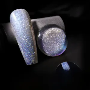 Close-up of sparkling silver blue glitter nail polish with diamond shine on nails