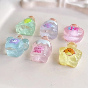 Mini resin wishing bottles with corks in various shapes and soft pastel colors