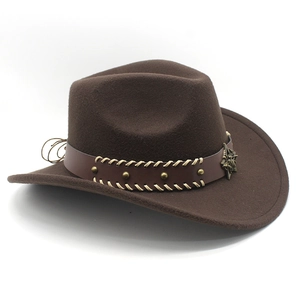 Detail of brown felt cowboy hat featuring leather band with star badge and metal rivets