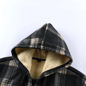 Detailed close-up of plaid hooded jacket with thick faux sherpa fleece lining and black zipper