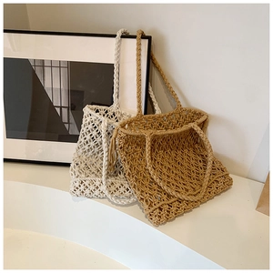 Detail of macrame knotted texture on beige and khaki woven beach tote bags