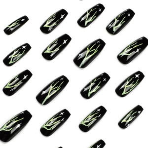 Black coffin press-on nails with neon green lightning pattern and star designs