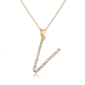Detailed view of an 18K gold plated V letter necklace with sparkling clear zircon stones
