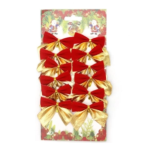 Detail of 12 red and gold velvet Christmas bows on festive display card packaging