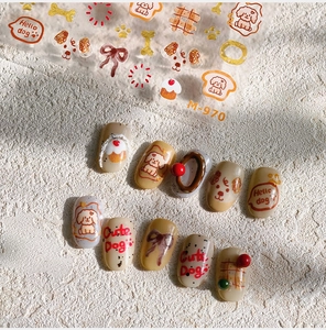 Detail of M-970 nail stickers with cute dog designs, cupcakes, and red plaid patterns