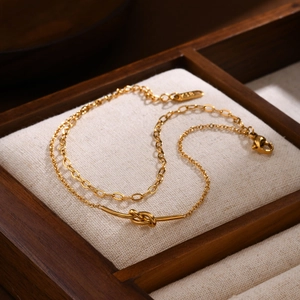 Double-layer 18K gold plated stainless steel knotted bracelet on wooden display box