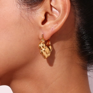 Detail shot of hollow double-layer lotus hoop earrings in 18K gold plated stainless steel