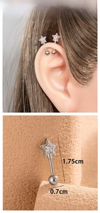 Detail of star-shaped titanium steel ear stud with colorful zircon and screw ball back