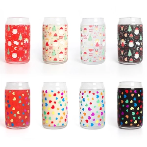 Detail of color-changing glass cans featuring Christmas motifs and colorful hearts
