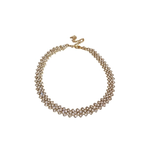 Elegant gold choker necklace featuring rows of sparkling diamonds and adjustable clasp