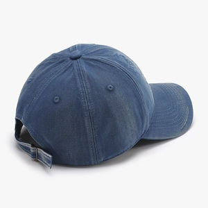 Adjustable washed denim baseball cap featuring retro distressed finish and metal buckle back